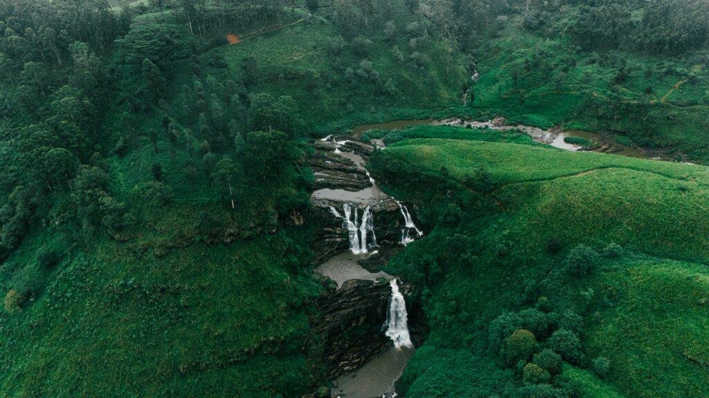 Scenic waterfall near Nuwara Eliya surrounded by lush greenery in Sri Lanka’s hill country
