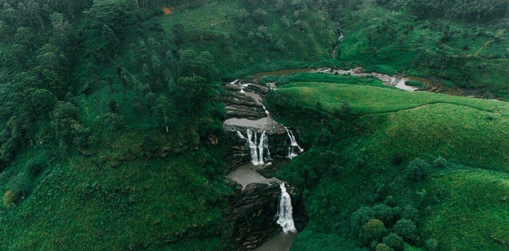 Scenic waterfall near Nuwara Eliya surrounded by lush greenery in Sri Lanka’s hill country