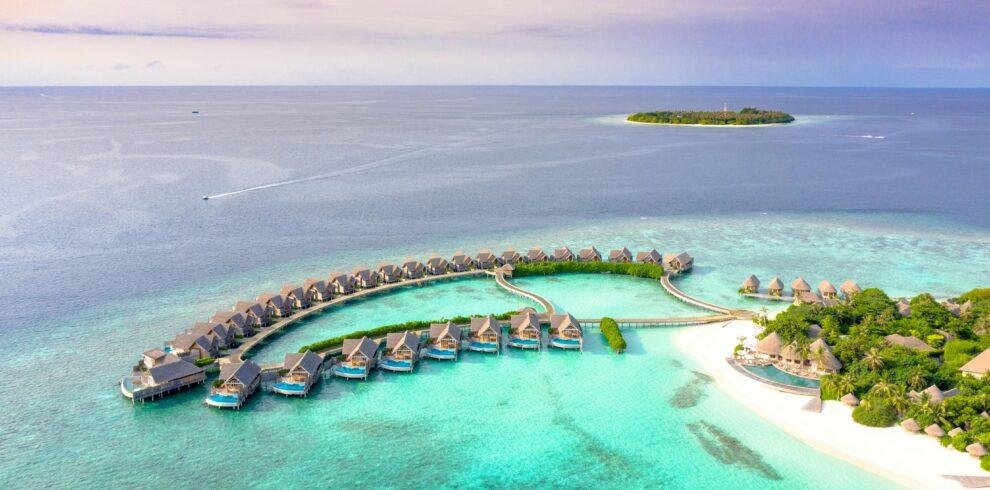 Sun Siyam Maldives luxury resort beachfront and overwater villas with turquoise lagoon